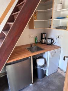 a small kitchen with a sink and a counter at Haus Abendsonne in Bad Schandau