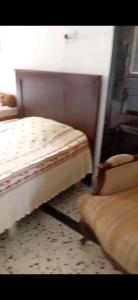 a bedroom with two beds in a room at Penthouse Sea Apartment in El Mîna
