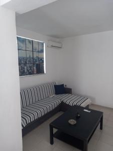 a living room with a couch and a table at Apartment PAPAS in Mastihari