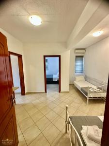 a large room with a bed and a bedroom at Griavas at campsite in Sykia Chalkidikis