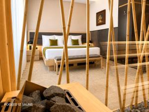 a bedroom with two beds and a table at Atera Business Suites in Belgrade