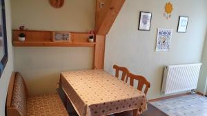 a small room with a table and a table and a chair at Ferienwohnung 2 in Bad Wilsnack