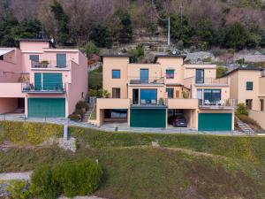 an aerial view of a row of houses at Lake Como View 3BR Regina 35 in Carate Urio