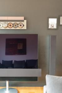 a living room with a couch in a room at Lake Como View 3BR Regina 35 in Carate Urio