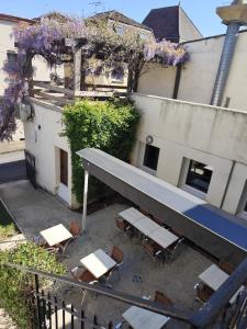 an overhead view of a building with tables and chairs at Le Rhum Antik in Puybrun