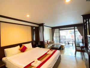 a bedroom with a large bed and a living room at Puektian Seaview in Ban Tanot Noi +33 photos