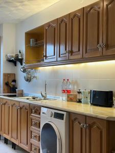 a kitchen with a washing machine on a counter at Peaceful Townhouse Retreat in Órgiva +32 photos
