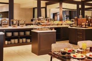 a restaurant with a buffet with food on a table at Mari Suites Hotel in Istanbul