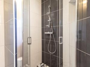 a bathroom with a shower with a glass door at Gite Paul Sallou in Perros-Guirec +13 photos