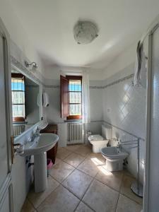a bathroom with two sinks and a toilet at Il Chicco d'Oro in Massarosa +54 photos