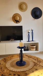 a candle sitting on top of a wooden table at Mandria Gardens Paradise II in Mandria
