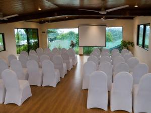 a conference room with white chairs and a screen at Mirage Kandyan Heights in Kandy +84 photos