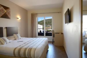 Postel nebo postele na pokoji v ubytování Hôtel A Madonetta