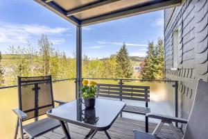 a patio with a table and chairs on a balcony at Apartment Burgquartier in Schmallenberg