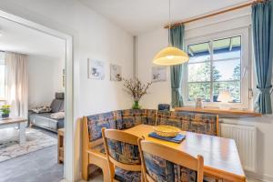 a living room with a table and a couch at Apartment Burgquartier in Schmallenberg