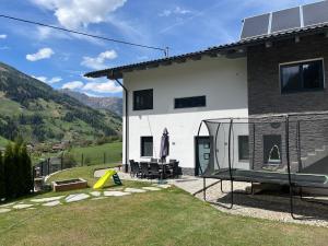 a house with a playground in front of it at Ferienappartement Sieger in Großkirchheim