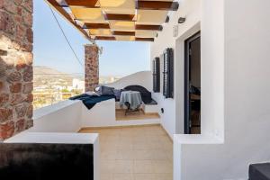 a view from the balcony of a house at Aelia Suites Akrotiri, Santorini in Akrotiri