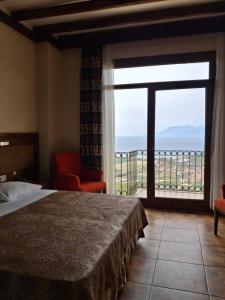 a bedroom with a bed and a large window at Masi Otel in Bademli +105 photos