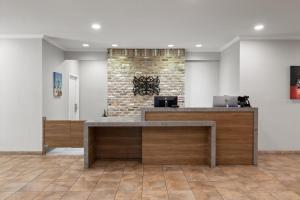 a lobby with a reception desk in a building at Candlewood Suites Mobile-Downtown by IHG in Mobile +33 photos