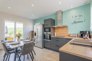 a kitchen and dining room with a table and chairs at Villa Lisa in Balazuc +12 photos