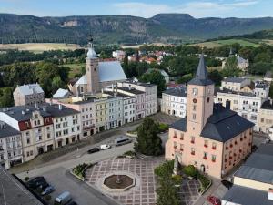 an aerial view of a city with buildings and a church at Apartament Florian Rynek 3 in Radków