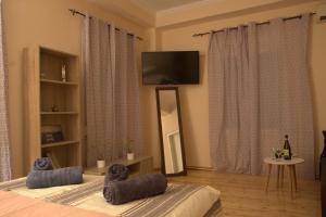 a bedroom with a bed with two teddy bears on it at Hidden gem agora flat Checkpoint-Mytilene in Mytilene