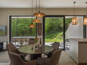 a kitchen and dining room with a table and chairs at steiRerBLiCke - Gaberhö Gamlitz in Gamlitz