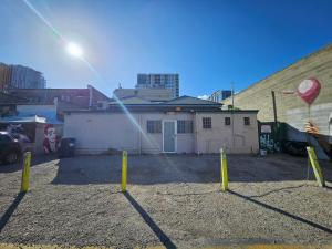 a yard with yellow poles in front of a building at Eden - Franklin 6 in Adelaide