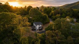 an aerial view of a house in the woods at Cliffside Modern Villa. Secluded and accessible. in Asheville