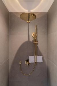 a bathroom with a shower with a light fixture at steiRerBLiCke - Gaberhö Gamlitz in Gamlitz +71 photos