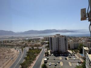 an aerial view of a city with a highway at Room 805 in Eilat