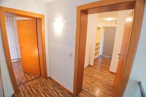 a hallway with a door leading to a room at EK-Living in Fügen +64 photos