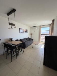 a living room with a couch and a table at Room 805 in Eilat