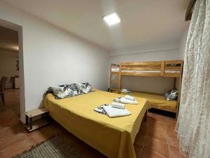a bedroom with two bunk beds with towels at Casa de Palma in Asprovalta