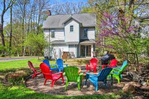 a group of colorful chairs in front of a house at A Shore Thing in Douglas