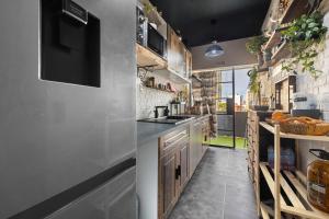 a kitchen with a sink and a counter top at Beach fun in Costa da Caparica