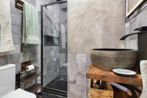 a bathroom with a sink and a shower at Beach fun in Costa da Caparica +36 photos
