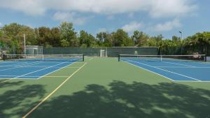 a tennis court with two tennis nets on it at 2306 Ocean Pointe Suites in Tavernier