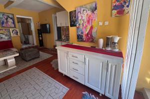 a room with a kitchen with a counter top at MM Apartman in Foča