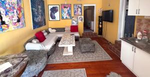 a living room with a couch and a table at MM Apartman in Foča