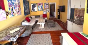 a living room with a couch and a table at MM Apartman in Foča +4 photos