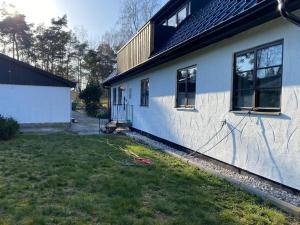 a house with graffiti on the side of it at Sandbybäcksvägen 1 in Borrby