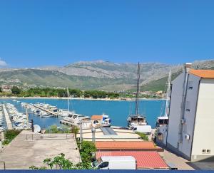 a group of boats docked in a marina at Apartment Kazela in Split