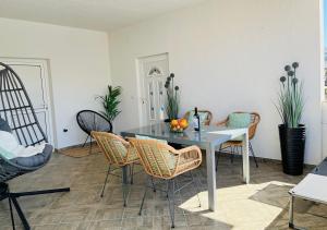 a dining room with a table and chairs at Sea View Apartments in Grebaštica +50 photos