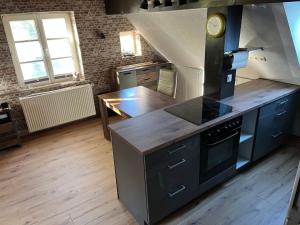 a kitchen with a stove and a counter top at Ferienwohnung in Ivenack, DG in Ivenack