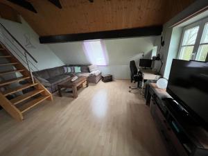 a large living room with a couch and a table at Ferienwohnung in Ivenack, DG in Ivenack