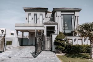 a house with a gate in front of it at Summer Villa in Lahore