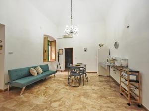 a living room with a couch and a table at Zio Achille in Gallipoli