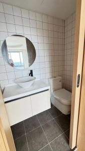 a bathroom with a sink and a toilet at Fantasea Condo Kamala 1bdr in Kamala Beach +5 photos