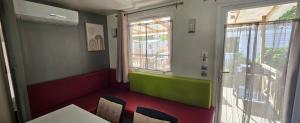 a room with a table and chairs and a window at A 15 minutes de l'océan, Mimizan plage in Aureilhan +45 photos